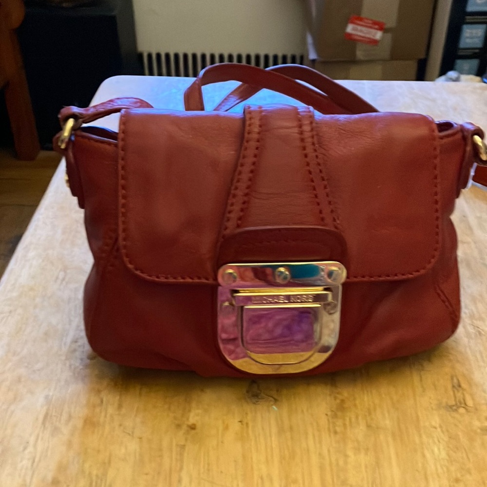 Michael Kors red leather crossbody handbag.
